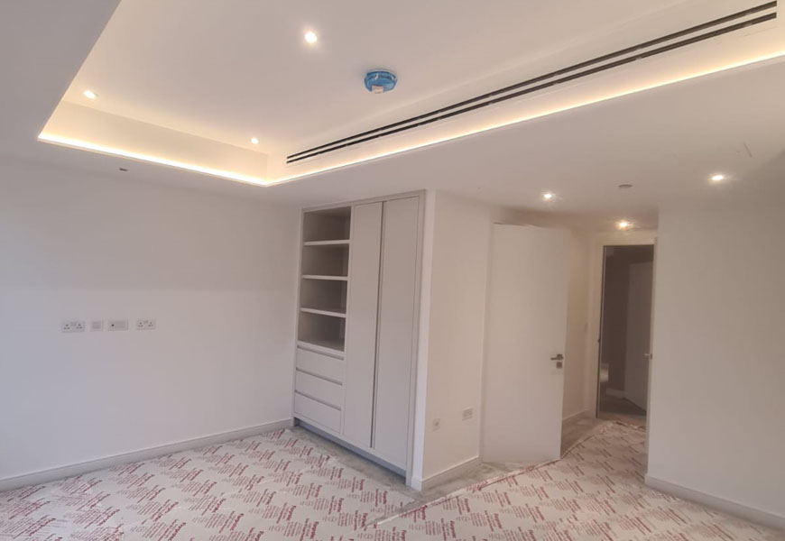 Bespoke LED lighting bulkhead in CitySuites Manchester apartment JWL Interiors